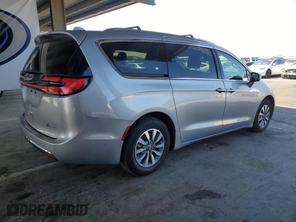 2021 Chrysler Pacifica Hybrid Touring L with VIN 2C4RC1L7XMR593911, listed as a Copart auction lot 57842415 with 74,910 mi miles and Salvage title. Bid and sale history available at DreamBid. Image 3.