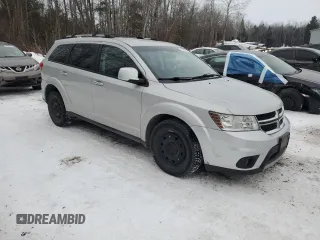 2013 Dodge Journey Crew with VIN 3C4PDCCG4DT698618, listed as a Copart auction lot 87632875 with 198,284 mi miles and Salvage title. Bid and sale history available at DreamBid. Image 4.