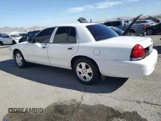 2011 Ford Crown Victoria LX z VIN 2FABP7EV1BX147343, wystawiony jako Copart lot #84844144 z przebiegiem 139 638 mil mil oraz Czysty tytuł • Clean title. Historia ofert i sprzedaży dostępna na DreamBid. Obrazek 2.