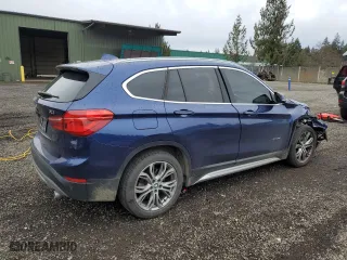 2018 BMW X1 xDrive28i with VIN WBXHT3C37J5F89432, listed as a Copart auction lot 49677075 with 141,684 mi miles and Salvage Title. Bid and sale history available at carsss.com. Image 3.