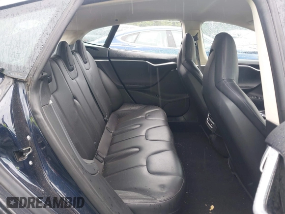 2014 Tesla Model S 60 with VIN 5YJSA1H19EFP32063, listed as a IAAI auction lot 42360872 with 103,495 mi miles and . Bid and sale history available at DreamBid. Image 8.