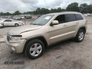 2012 Jeep Grand Cherokee Laredo with VIN 1C4RJEAGXCC157616, listed as a IAAI auction lot 42156539 with 301,661 mi miles. Bid and sale history available at carsss.com. Image 17.