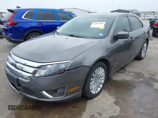 2012 Ford Fusion Hybrid z VIN 3FADP0L33CR289548, wystawiony jako IAAI lot #41905806 z przebiegiem 121 233 mil mil oraz . Historia ofert i sprzedaży dostępna na DreamBid. Obrazek 2.