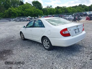 2004 Toyota Camry LE with VIN JTDBE32KX40279599, listed as a IAAI auction lot 42202160 with 288,879 mi miles and . Bid and sale history available at carsss.com. Image 3.