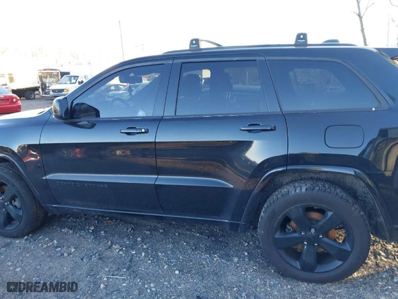 2015 Jeep Grand Cherokee Altitude with VIN 1C4RJFAG6FC796571, listed as a IAAI auction lot 41258471 with 104,049 mi miles. Bid and sale history available at carsss.com. Image 14.