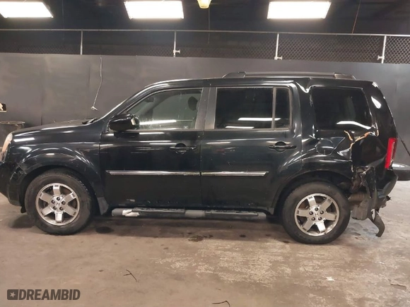 2011 Honda Pilot Touring with VIN 5FNYF4H97BB099528, listed as a IAAI auction lot 41721800 with 132,979 mi miles. Bid and sale history available at carsss.com. Image 14.
