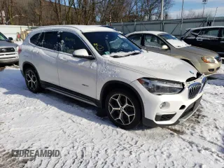 2017 BMW X1 xDrive28i with VIN WBXHT3C33H5F77000, listed as a Copart auction lot 41860993 with 113,553 mi miles. Bid and sale history available at carsss.com. Image 4.