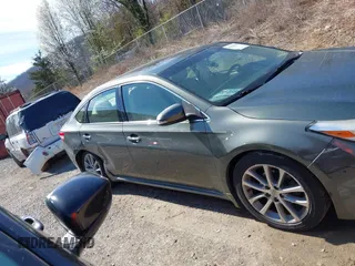 2014 Toyota Avalon Limited z VIN 4T1BK1EB0EU118032, wystawiony jako IAAI lot #41864586 z przebiegiem 72 477 mil mil oraz . Historia ofert i sprzedaży dostępna na DreamBid. Obrazek 14.