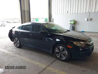 2016 Honda Civic EX-L z VIN 2HGFC1F77GH653461, wystawiony jako IAAI lot #41862027 z przebiegiem 156 930 mil mil oraz . Historia ofert i sprzedaży dostępna na DreamBid. Obrazek 1.