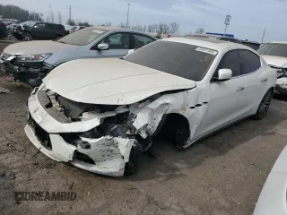 2014 Maserati Ghibli S Q4 z VIN ZAM57RTA2E1083387, wystawiony jako Copart lot #53621465 z przebiegiem Nie podano mil oraz Szkody całkowita. Historia ofert i sprzedaży dostępna na DreamBid. Obrazek 1.