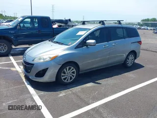 2012 Mazda 5 Sport z VIN JM1CW2BL1C0112647, wystawiony jako IAAI lot #42508246 z przebiegiem 170 765 mil mil oraz . Historia ofert i sprzedaży dostępna na DreamBid. Obrazek 2.