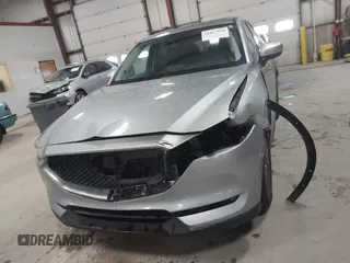 2020 Mazda CX-5 Touring with VIN JM3KFBCMXL0784653, listed as a IAAI auction lot 41817904 with 71,513 mi miles and . Bid and sale history available at carsss.com. Image 12.