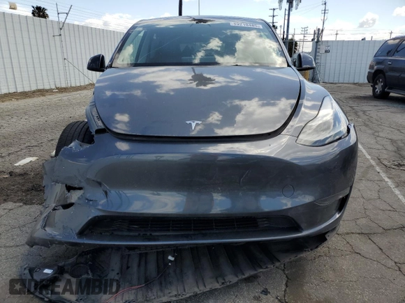2023 Tesla Model Y Long Range z VIN 7SAYGAEE7PF714828, wystawiony jako Copart lot #89210485 z przebiegiem 42 256 mil mil oraz Szkoda całkowita • Salvage title. Historia ofert i sprzedaży dostępna na DreamBid. Obrazek 5.