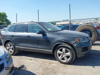 2012 Volkswagen Touareg Sport z VIN WVGFF9BP3CD003376, wystawiony jako IAAI lot #42249714 z przebiegiem 248 635 mil mil oraz . Historia ofert i sprzedaży dostępna na DreamBid. Obrazek 13.