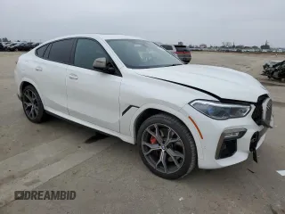 2021 BMW X6 M50i with VIN 5UXCY8C04M9D98395, listed as a Copart auction lot 85536134 with 57,891 mi miles and Salvage Title. Bid and sale history available at carsss.com. Image 4.