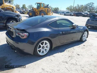 2013 Subaru BRZ Limited with VIN JF1ZCAC18D1602613, listed as a IAAI auction lot 41756384 with 136,519 mi miles. Bid and sale history available at carsss.com. Image 4.