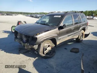 2004 Jeep Grand Cherokee Laredo with VIN 1J4GW48S14C377803, listed as a Copart auction lot 57515055 with 246,149 mi miles and Salvage title. Bid and sale history available at DreamBid. Image 1.