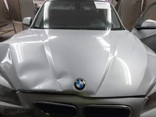 2015 BMW X1 sDrive28i with VIN WBAVM1C50FVW57526, listed as a IAAI auction lot 41888323 with 160,160 mi miles. Bid and sale history available at carsss.com. Image 10.