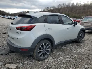 2019 Mazda CX-3 Touring with VIN JM1DKFC78K0405131, listed as a Copart auction lot 87065614 with 91,091 mi miles and Salvage Title. Bid and sale history available at carsss.com. Image 3.