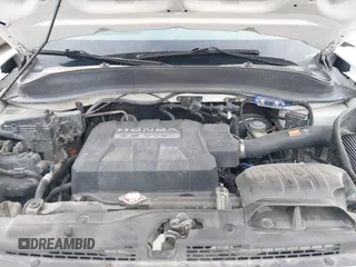 2006 Honda Ridgeline RTL z VIN 2HJYK16586H519593, wystawiony jako IAAI lot #42111678 z przebiegiem 244 962 mil mil oraz . Historia ofert i sprzedaży dostępna na DreamBid. Obrazek 10.