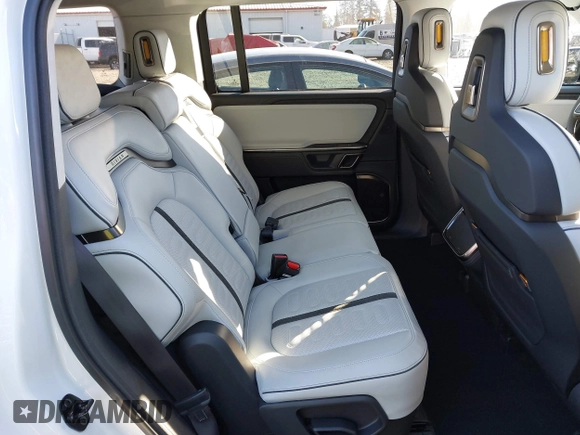 2024 Rivian R1S Adventure with VIN 7PDSGBBA9RN039684, listed as a IAAI auction lot 41558846 with 13,725 mi miles. Bid and sale history available at carsss.com. Image 8.