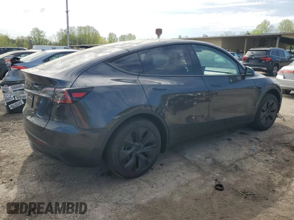 2025 Tesla Model Y Long Range with VIN 7SAYGDED7SF320702, listed as a Copart auction lot 54655325 with 1,169 mi miles and Salvage Title. Bid and sale history available at DreamBid. Image 3.