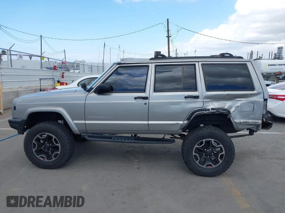 2000 Jeep Cherokee z VIN 1J4FF48S1YL200458, wystawiony jako IAAI lot #42239282 z przebiegiem Nie podano mil oraz . Historia ofert i sprzedaży dostępna na DreamBid. Obrazek 14.