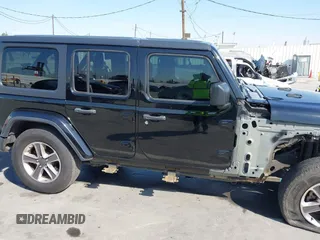 2020 Jeep Wrangler Unlimited Sahara with VIN 1C4HJXEN7LW230214, listed as a IAAI auction lot 41812466 with 59,004 mi miles. Bid and sale history available at carsss.com. Image 14.