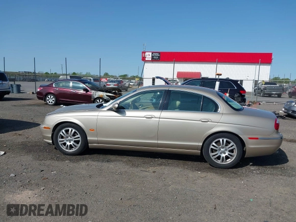 2005 Jaguar S-Type with VIN SAJWA01T95FN22745, listed as a IAAI auction lot 41898269 with 57,614 mi miles and . Bid and sale history available at DreamBid. Image 14.