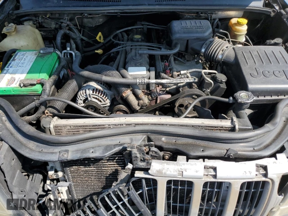 2004 Jeep Grand Cherokee Laredo z VIN 1J4GW48S24C217901, wystawiony jako Copart lot #60436675 z przebiegiem 263 837 mil mil oraz Szkoda całkowita • Salvage title. Historia ofert i sprzedaży dostępna na DreamBid. Obrazek 11.