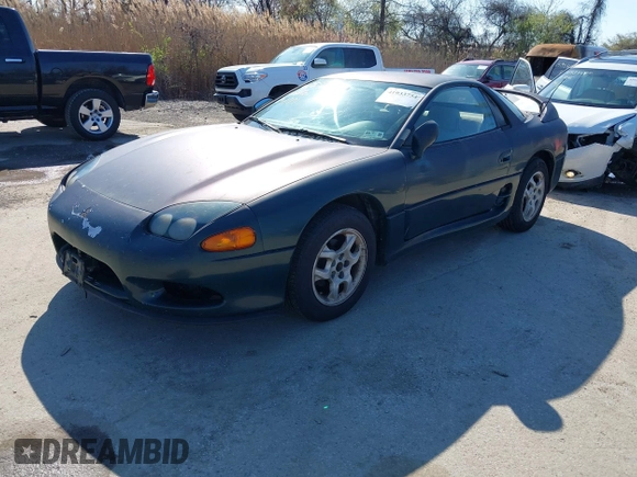 1997 Mitsubishi 3000GT z VIN JA3AM44H8VY001162, wystawiony jako IAAI lot #41933754 z przebiegiem 157 314 mil mil oraz . Historia ofert i sprzedaży dostępna na DreamBid. Obrazek 2.