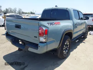 2022 Toyota Tacoma SR with VIN 3TYCZ5AN0NT104300, listed as a IAAI auction lot 42652503 with 18,071 mi miles and . Bid and sale history available at DreamBid. Image 4.