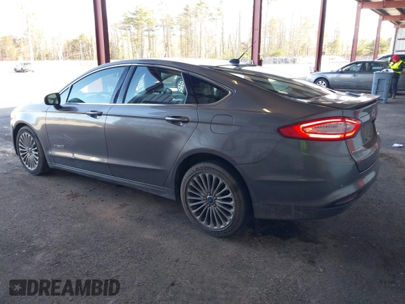 2013 Ford Fusion Titanium Hybrid with VIN 3FA6P0RU0DR277092, listed as a IAAI auction lot 41811079 with 123,071 mi miles. Bid and sale history available at carsss.com. Image 3.