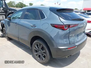 2022 Mazda CX-30 S Carbon Edition with VIN 3MVDMBCL6NM410330, listed as a IAAI auction lot 42107426 with 30,277 mi miles and . Bid and sale history available at DreamBid. Image 3.