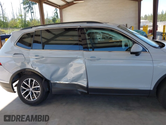 2018 Volkswagen Tiguan SEL z VIN 3VV2B7AX0JM197274, wystawiony jako IAAI lot #42392421 z przebiegiem 45 453 mil mil oraz . Historia ofert i sprzedaży dostępna na DreamBid. Obrazek 13.