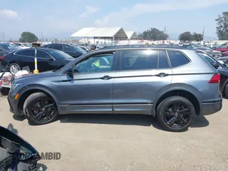 2023 Volkswagen Tiguan SE R-Line Black with VIN 3VVCB7AX8PM036684, listed as a IAAI auction lot 42169004 with 25,024 mi miles and . Bid and sale history available at DreamBid. Image 13.