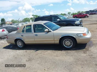 2000 Mercury Grand Marquis GS z VIN 2MEFM74W3YX610461, wystawiony jako IAAI lot #42162767 z przebiegiem 181 400 mil mil oraz . Historia ofert i sprzedaży dostępna na DreamBid. Obrazek 13.