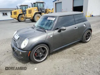 2006 MINI Hardtop S with VIN WMWRE33506TL20411, listed as a Copart auction lot 65915715 with 110,340 mi miles and Salvage title. Bid and sale history available at DreamBid. Image 1.