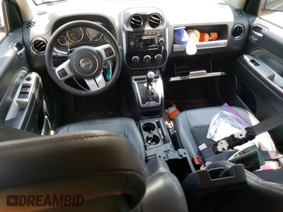 2016 Jeep Compass Latitude with VIN 1C4NJDEB4GD758009, listed as a Copart auction lot 60704745 with 143,393 mi miles and Salvage title. Bid and sale history available at DreamBid. Image 8.