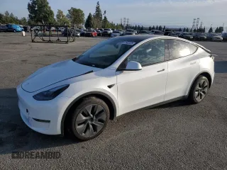 2024 Tesla Model Y with VIN 7SAYGDED6RF110635, listed as a Copart auction lot 47502525 with 9,412 mi miles and Salvage Title. Bid and sale history available at DreamBid. Image 1.