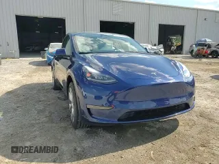2023 Tesla Model Y Long Range z VIN 7SAYGDEE3PA178832, wystawiony jako Copart lot #57156005 z przebiegiem 12 920 mil mil oraz Szkoda całkowita • Salvage title. Historia ofert i sprzedaży dostępna na DreamBid. Obrazek 13.