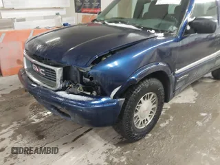 1999 GMC Jimmy SLE with VIN 1GKDT13W8X2534672, listed as a IAAI auction lot 41562434 with 240,145 mi miles. Bid and sale history available at carsss.com. Image 6.