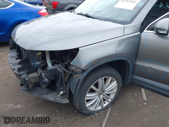 2011 Volkswagen Tiguan SE with VIN WVGBV7AX4BW532524, listed as a IAAI auction lot 41757552 with 141,115 mi miles and . Bid and sale history available at DreamBid. Image 12.