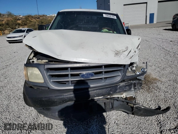2000 Ford F-150 XL with VIN 2FTPF17Z5YCA99717, listed as a Copart auction lot 70658194 with Not provided miles and Salvage title. Bid and sale history available at DreamBid. Image 5.