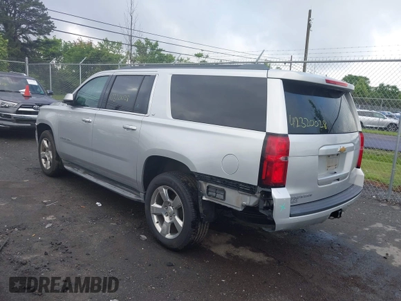 2015 Chevrolet Suburban LT z VIN 1GNSCJKC2FR144528, wystawiony jako IAAI lot #42320028 z przebiegiem 226 076 mil mil oraz . Historia ofert i sprzedaży dostępna na DreamBid. Obrazek 3.