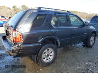 2003 Isuzu Rodeo with VIN 4S2CK58W334306303, listed as a Copart auction lot 83820444 with 180,040 mi miles and Salvage Title. Bid and sale history available at DreamBid. Image 3.