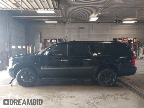 2010 Chevrolet Suburban LTZ with VIN 1GNUKKE39AR106851, listed as a IAAI auction lot 41994155 with 148,776 mi miles. Bid and sale history available at carsss.com. Image 14.