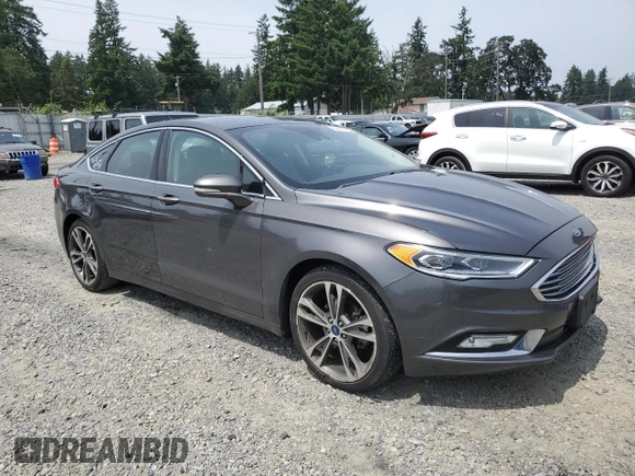 2017 Ford Fusion Titanium z VIN 3FA6P0K95HR139060, wystawiony jako Copart lot #62200755 z przebiegiem 106 133 mil mil oraz Szkoda całkowita • Salvage title. Historia ofert i sprzedaży dostępna na DreamBid. Obrazek 4.
