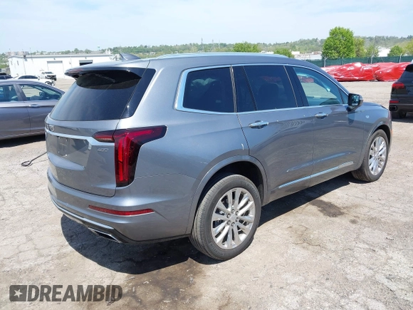 2022 Cadillac XT6 Premium Luxury z VIN 1GYKPDRS4NZ146284, wystawiony jako IAAI lot #42150678 z przebiegiem 28 890 mil mil oraz . Historia ofert i sprzedaży dostępna na DreamBid. Obrazek 4.