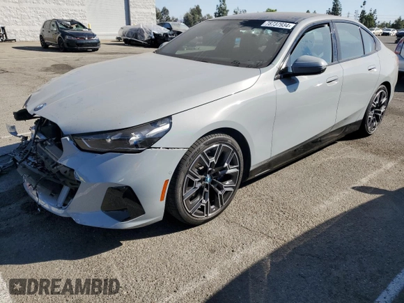 2024 BMW i5 eDrive40 with VIN WBY33FK01RCN99702, listed as a Copart auction lot 78737934 with 11,889 mi miles and Salvage Title. Bid and sale history available at carsss.com. Image 1.